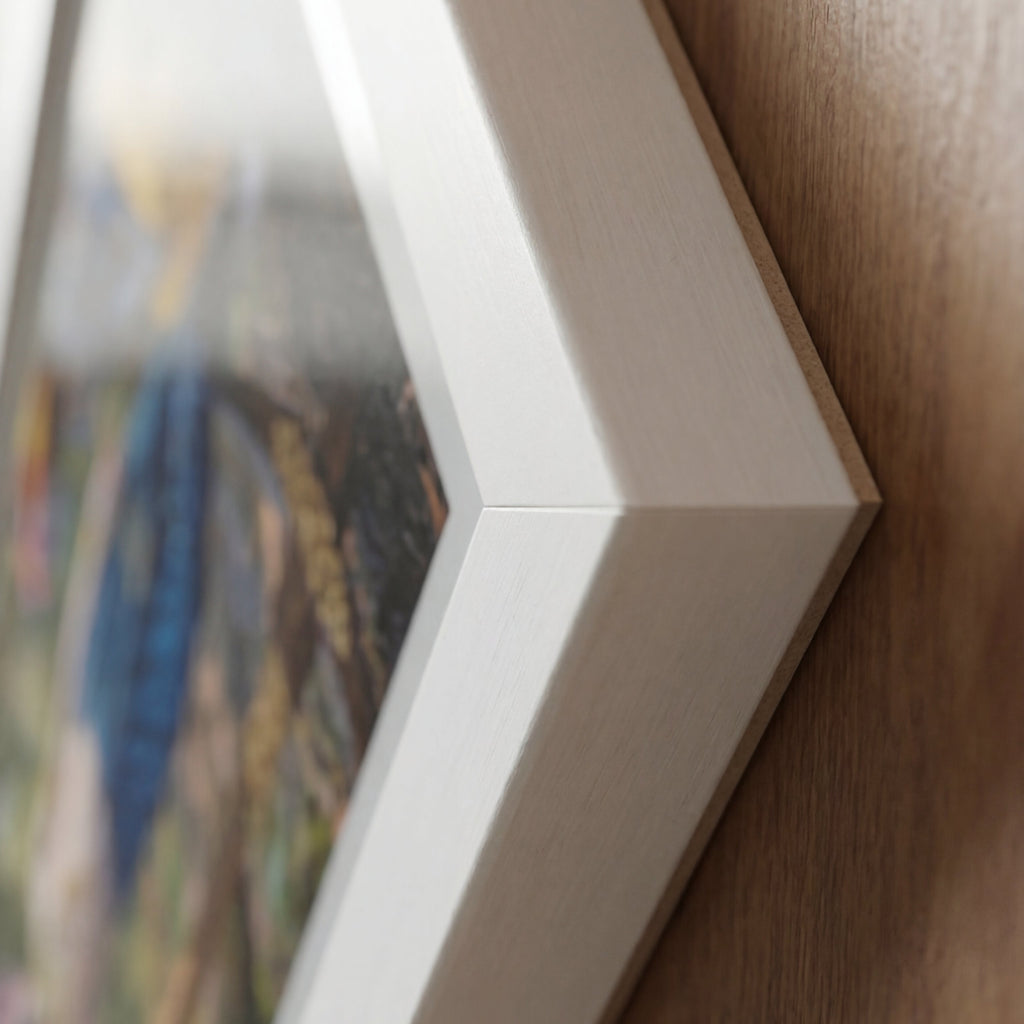 Close-up of a framed picture on a wooden surface