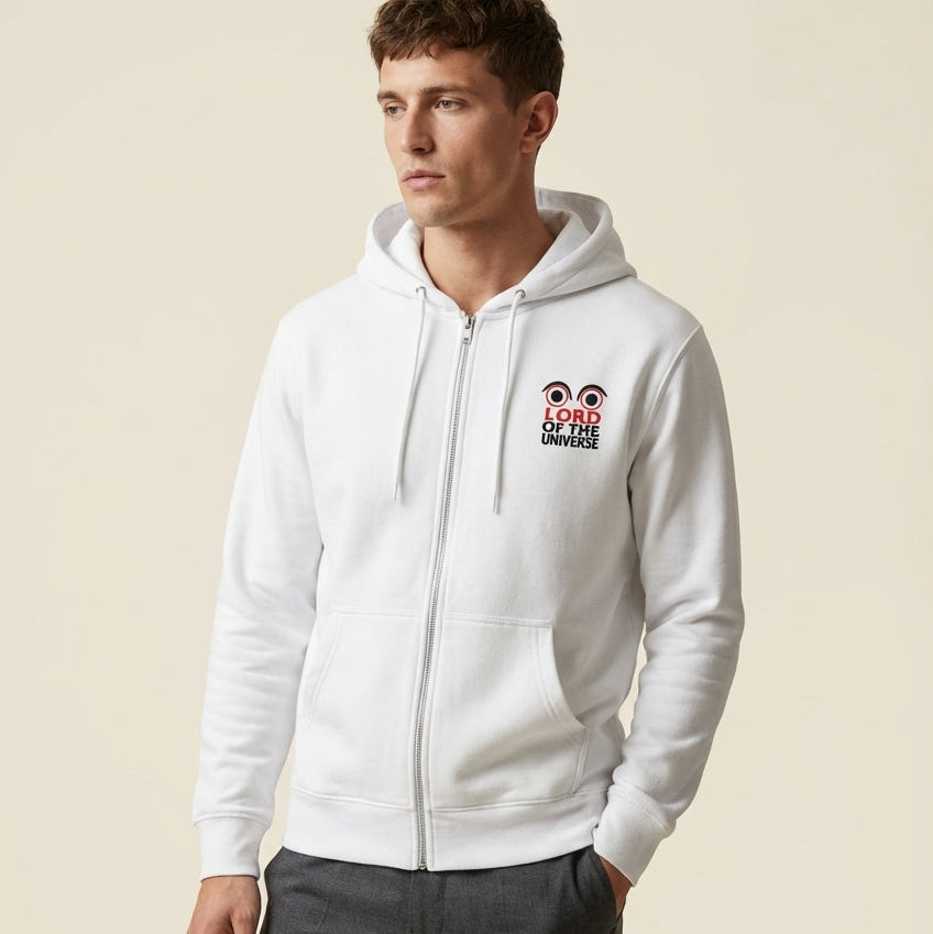 Man wearing a white hoodie with a logo on a beige background