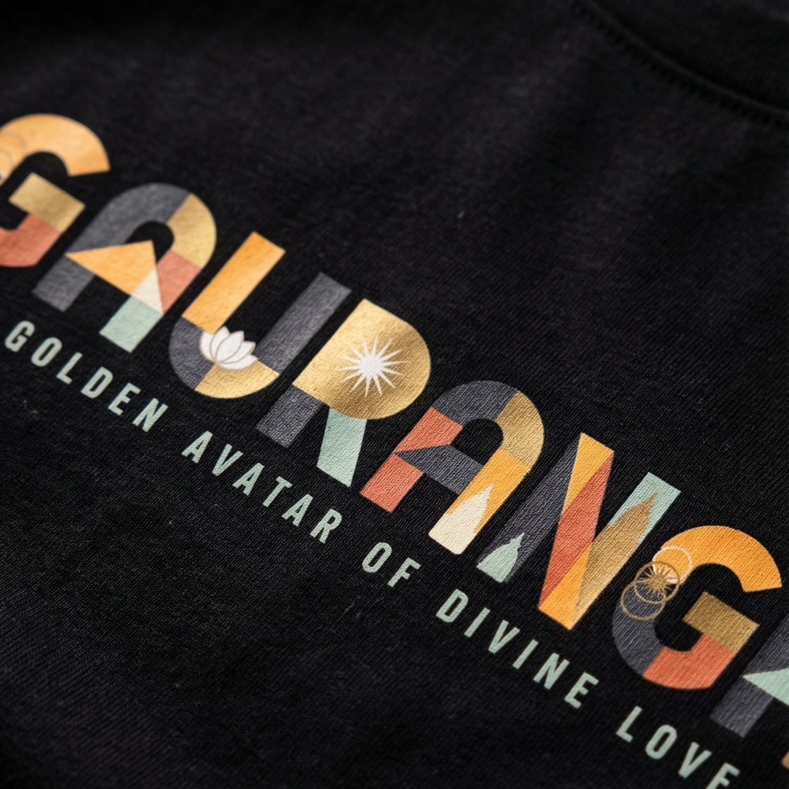Black t-shirt with colorful 'Gaurang' text design on a dark background