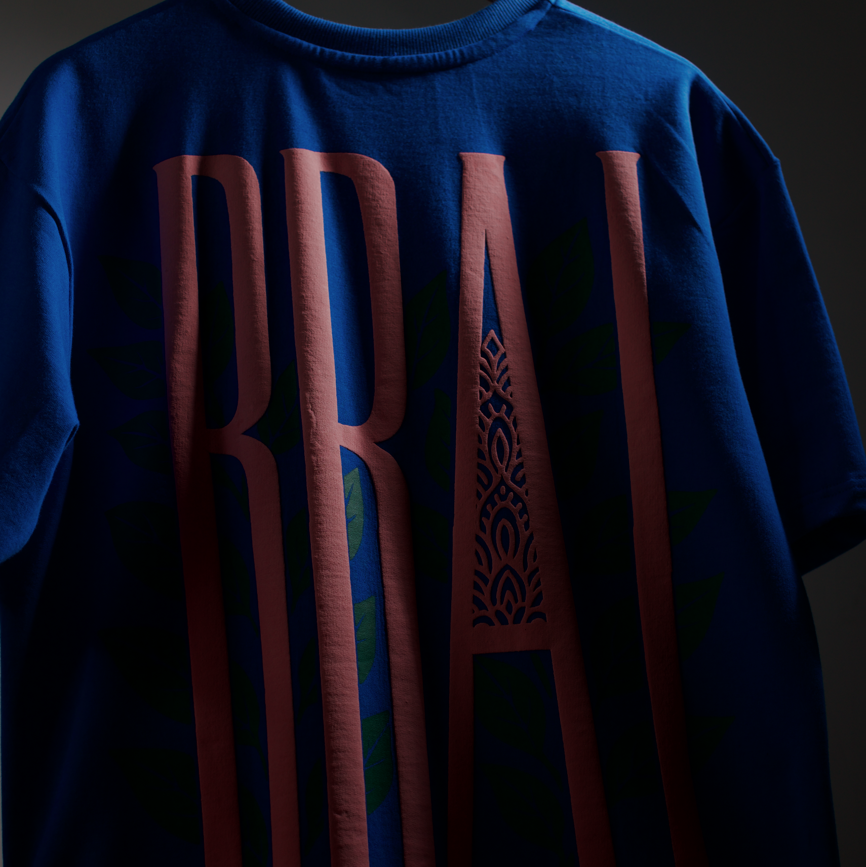 Blue t-shirt with red text and design on a dark background