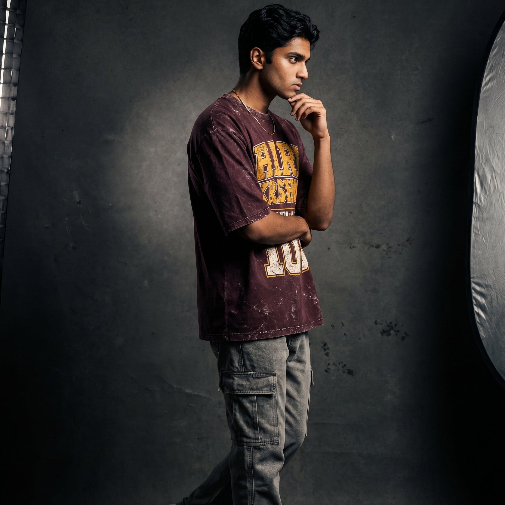 Person posing in a studio setting with lighting equipment