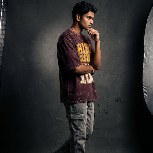 Person posing in a studio setting with lighting equipment